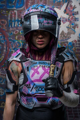 Furious female activist armed with baseball bat against graffiti