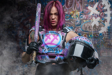 Pink haired aggressive woman holding helmet and baseball bat