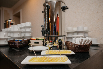 Cups for coffee and tea at the Banquet. The self-serve station. Coffee, sugar,