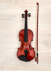 Fototapeta na wymiar violin and bow on white