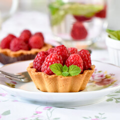 Mini tarts with raspberries fruits