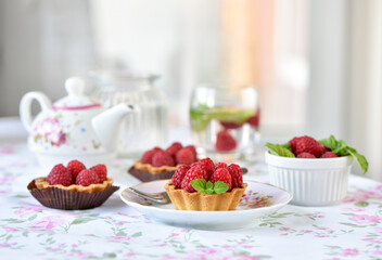 Mini tarts with raspberries fruits
