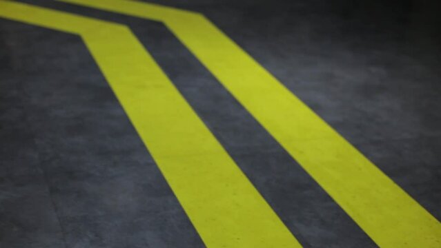 yellow guide strips on a modern concrete floor