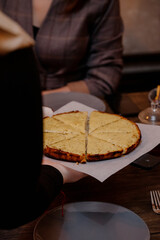waiter carrying a plate of pie