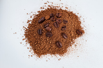Love coffee concept. Pile of powdered, instant coffee and beans coffee isolated on white background