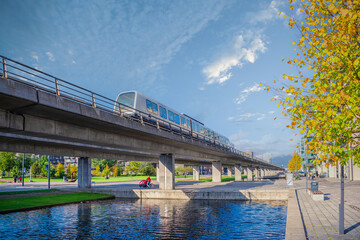 automatic  driverless metro subway M1 line rides over a bridgenear the Ørestads Boulevard in the...
