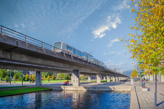 automatic  driverless metro subway M1 line rides over a bridgenear the &Oslash;restads Boulevard in the &Oslash;restad city area in Copenhagen, Denmark