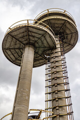 New York State Pavilion Observation Towers close-up, view from low angle, Flushing-Meadows-Park, New York City during overcast winter day, vertical