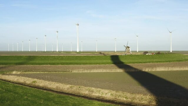 Wind turbines and windmill in field, Eemshaven, Netherlands