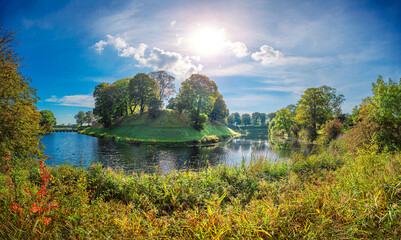 Panorama of the park with water channels and forest around the castle citadel Kastellet, the former earthworks now serving as a greenspace - obrazy, fototapety, plakaty