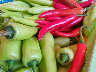 Top view of green bell and red peppers as a background for sale in the market at Thailand, abstract background, for cooking or salad, healthy food concept