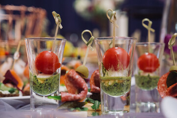 Cheese canapes with wine on table. Catering.