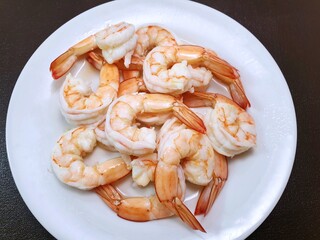 Top view of steamed shrimp on white plate as a background in restaurant, Ready to cooking or eat or serve