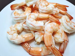 Top view of steamed shrimp on white plate as a background in restaurant, Ready to cooking or eat or serve