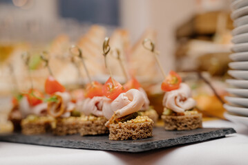 Cheese canapes with wine on table. Catering.
