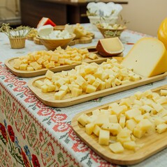 cheese plate in a dish on a Russian tablecloth