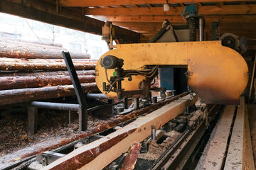 The process of sawing wood on sawmill equipment. Timber industry