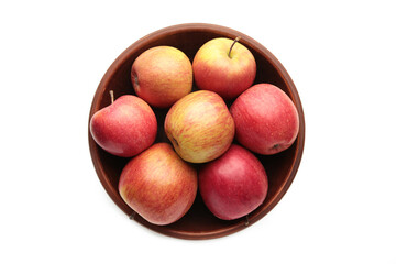 Many red apples in round bowl isolated on white background.