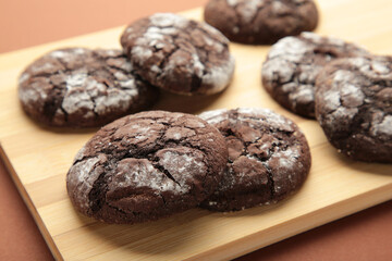 Soft dark chocolate brownie cookies on cutting board.