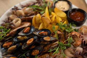 person is going to eat seafood. middle kitchen
