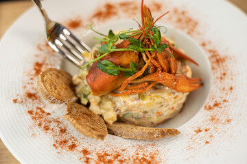 person is going to eat seafood. middle kitchen
