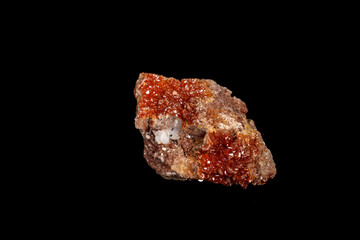 Macro mineral stone Vanadinite on a black background