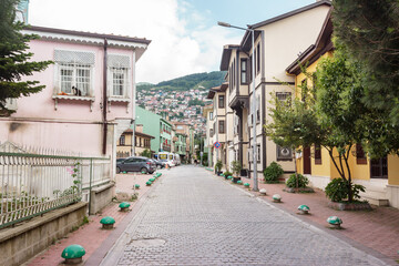 Old street view in Bursa with historical Turkish houses. Historical Ottoman city in Turkey.