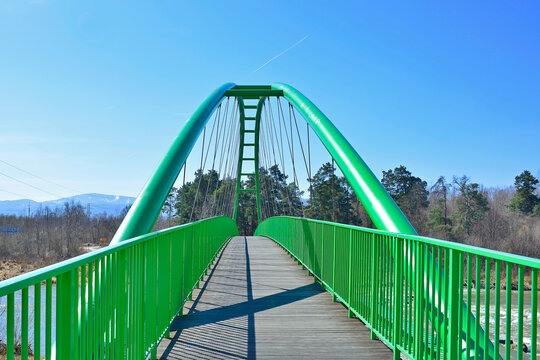 Modern architecture cycling path. Green bridge  for bikers and pedestrians over Poprad river in Stary Sacz, Poland.  Velo Dunajec cycling road.