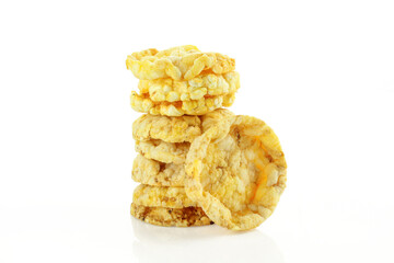 Stack of crispy and spicy flavoured corn snacks isolated on white background