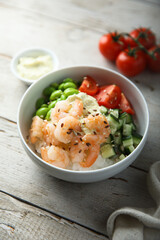 Homemade rice bowl with shrimps and vegetables