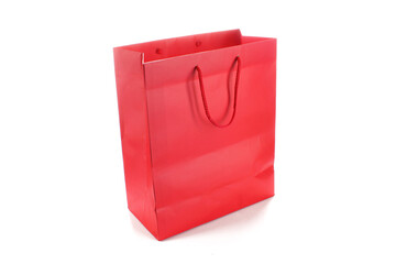 Empty blank red paper bag for clothes shopping isolated on white background