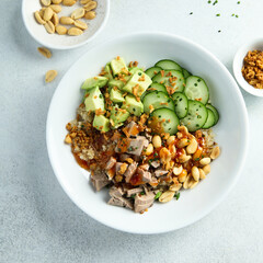 Rice bowl with duck and avocado