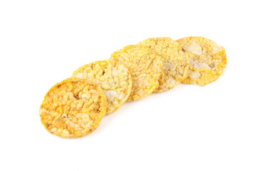 Stack of thin corn rice cracker chips isolated on white background. Healthy dietetic food