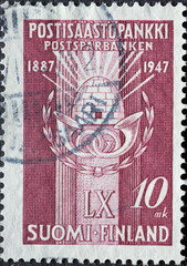 Finland - circa 1947: a postage stamp from Finland , showing an emblem with post horns. Savings Bank 60th Anniversary