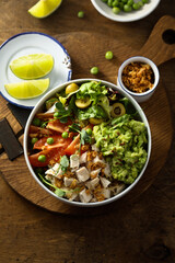 Healthy bowl with chicken and avocado