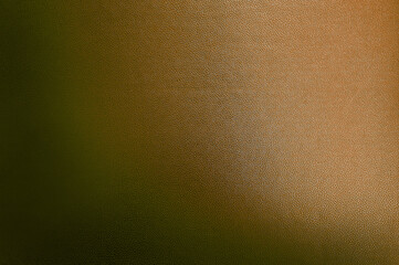 luxury dark brown leather texture background showing grain and a shaft of light across. gradient brown artificial leatherette texture use as background, close up view, with blank space for design.