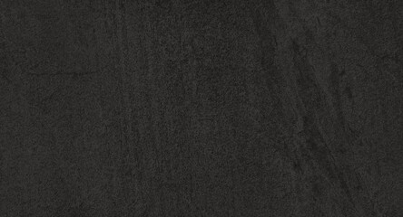 dark black slate background or texture. close up ceramic stone tile texture use as background with...