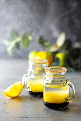 multi-layered cocktail, shot of alcoholic cocktail, drink with three layers of alcohol in a shot glass