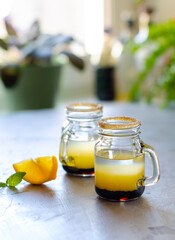 multi-layered cocktail, shot of alcoholic cocktail, drink with three layers of alcohol in a shot glass