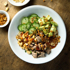 Rice bowl with duck and avocado