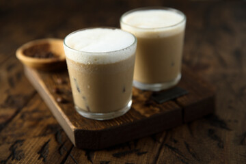 Iced coffee drink with milk foam