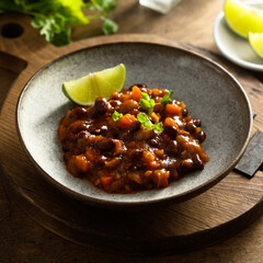Homemade red bean ragout with vegetables and lime