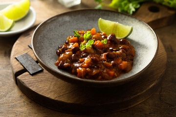 Homemade red bean ragout with vegetables and lime