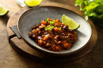 Homemade red bean ragout with vegetables and lime