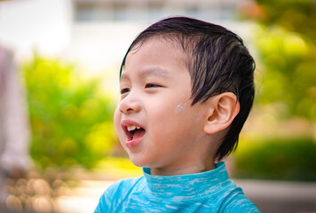 Portrait of a young boy with irritable face on blurred background. Closeup portrait Angry young Boy. Emotion Concept.