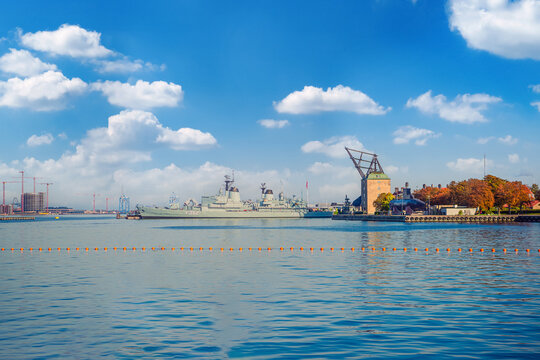 Holmen Naval Base and Masting Sheer Mastekranen and the Design Building with big warship. Copenhagen, Denmark