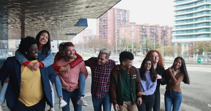 Young diverse people having fun outdoor laughing together - Diversity concept