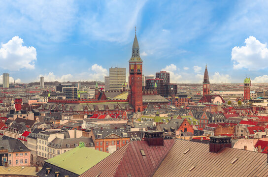 Panoramic view of the roofs of buildings in the central part of the old city and tower of Copenhagen City Hall. Copenhagen, Denmark
