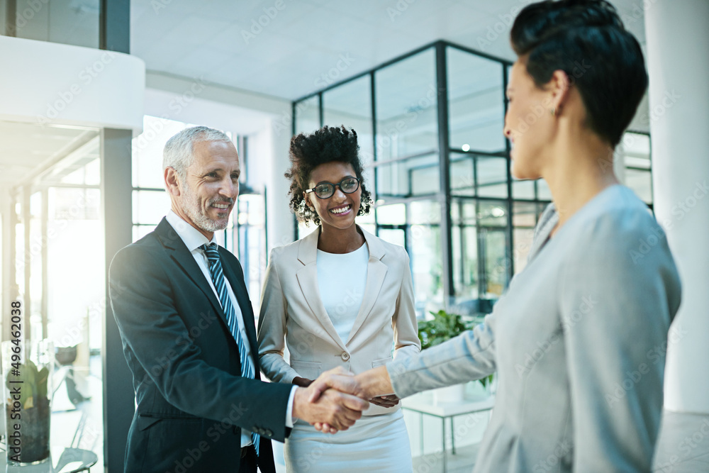 Poster theyre always happy to add members to the team. shot of businesspeople shaking hands in an modern of