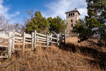 Wooden stairs lead to the base of the abandoned water tower at Ha Ha Tonka State Park, Missouri
